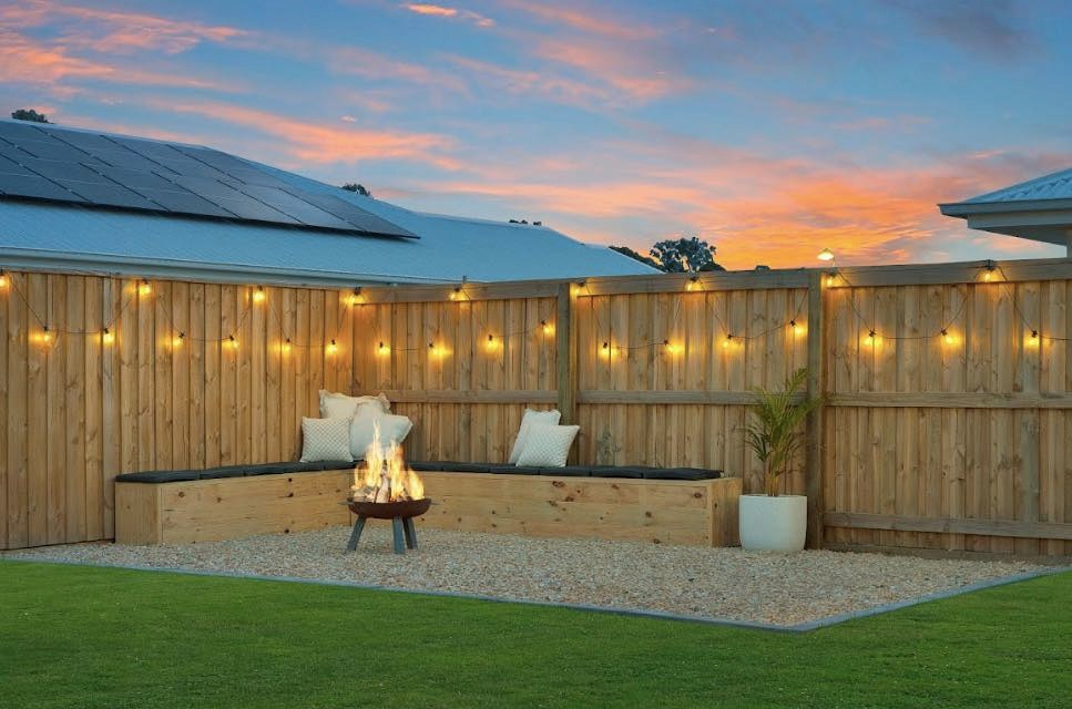 Outdoor entertaining area with string lights and fire pit - backyard electrical by Fully Spark'd Electrical