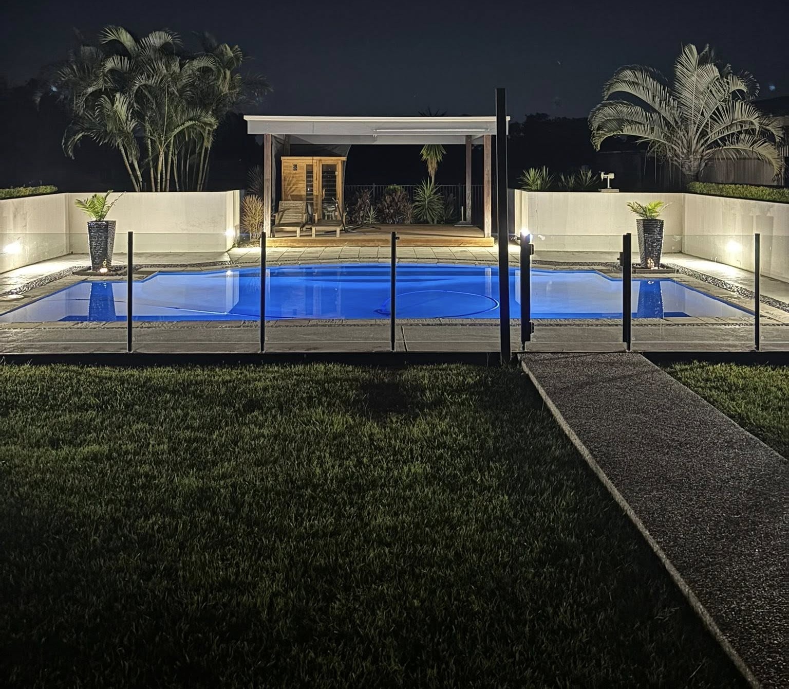 Pool lighting installation Jimboomba - LED underwater pool and landscape lighting at night by Fully Spark'd Electrical